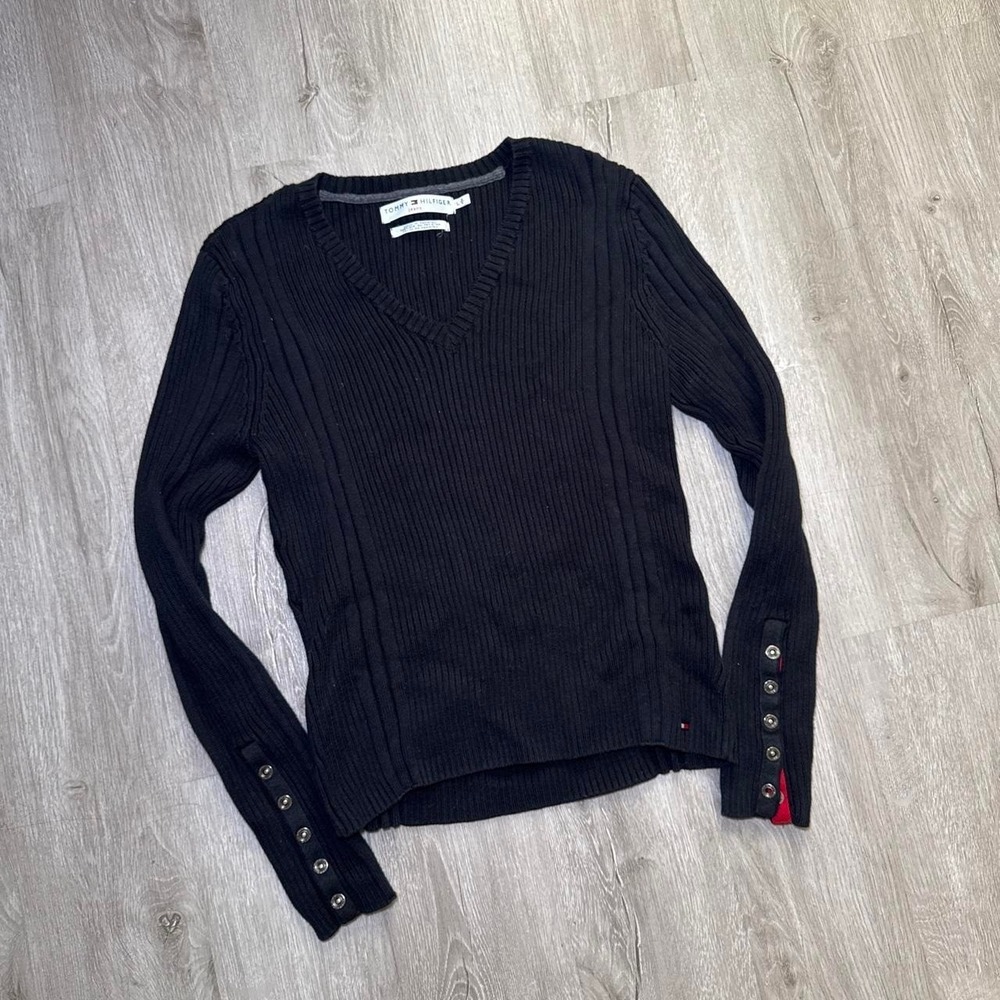Black Tommy Hilfiger ribbed knit sweater with button detail on sleeves
